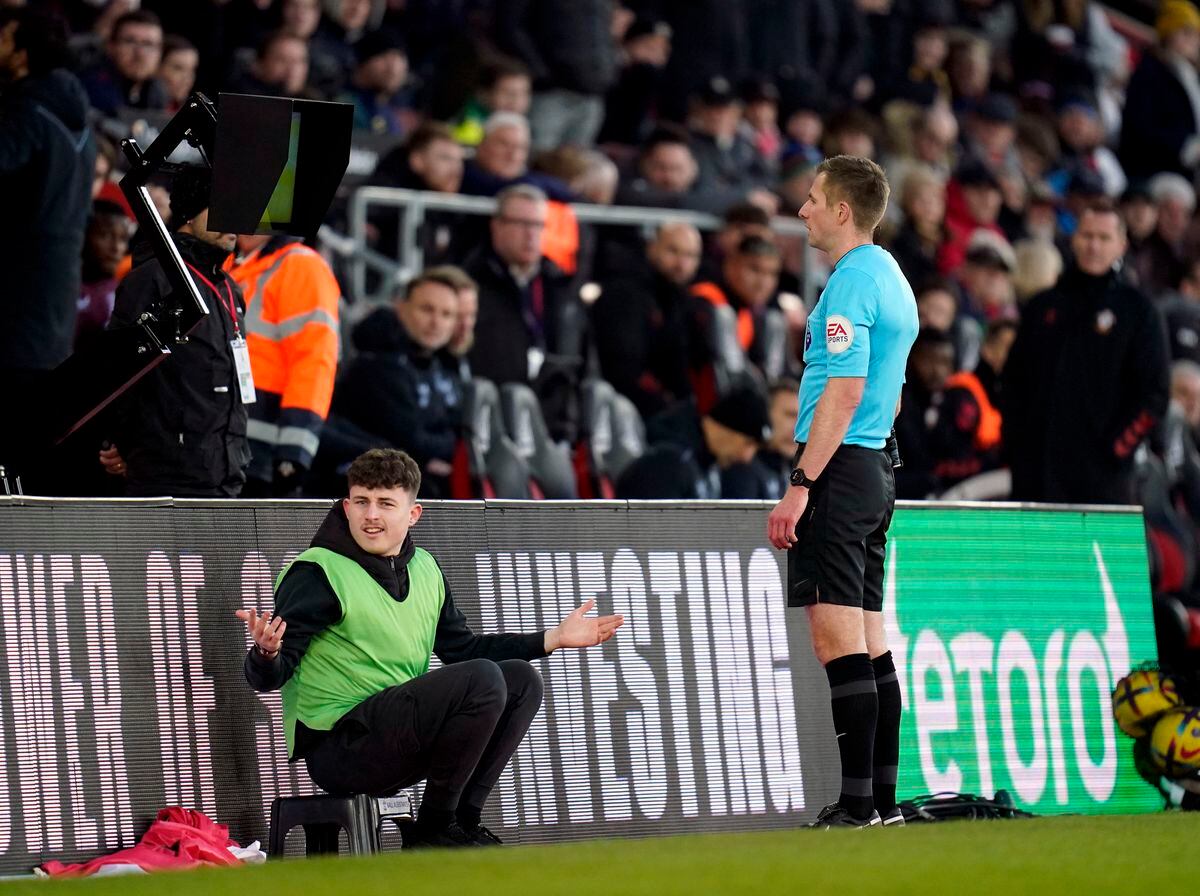               Referee Michael Salisbury checks the pitch side VAR monitor before ruling out the goal by Southampton's James Ward-Prowse (not pictured)