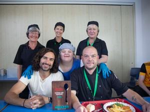 Joe Wicks poses with the team at Wyre Forest School in Kidderminster after presenting them with their trophy