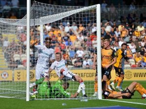 SPORT COPYRIGHT SHROPSHIRE STAR STEVE LEATH 06/08/2022..Newport County AFC V Walsall.   N: Mickey Demetriou gets a home goal (double check). In goal is W: Peter Clarke and Timmy Abraham..