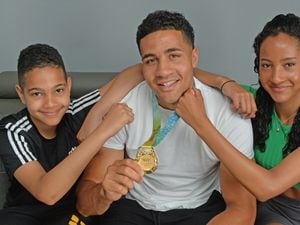 Commonwealth Games gold medallist Delicious Orie, back home in Bilston. Pictured with his brother Ben, 12, and sister Vivian ,15.