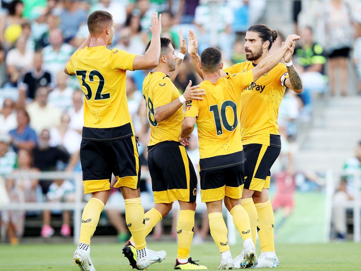 Ruben Neves celebrates with teammates after scoring in the friendly against Sporting CP