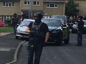 Armed police in Keats Road, Wolverhampton, where one man was arrested