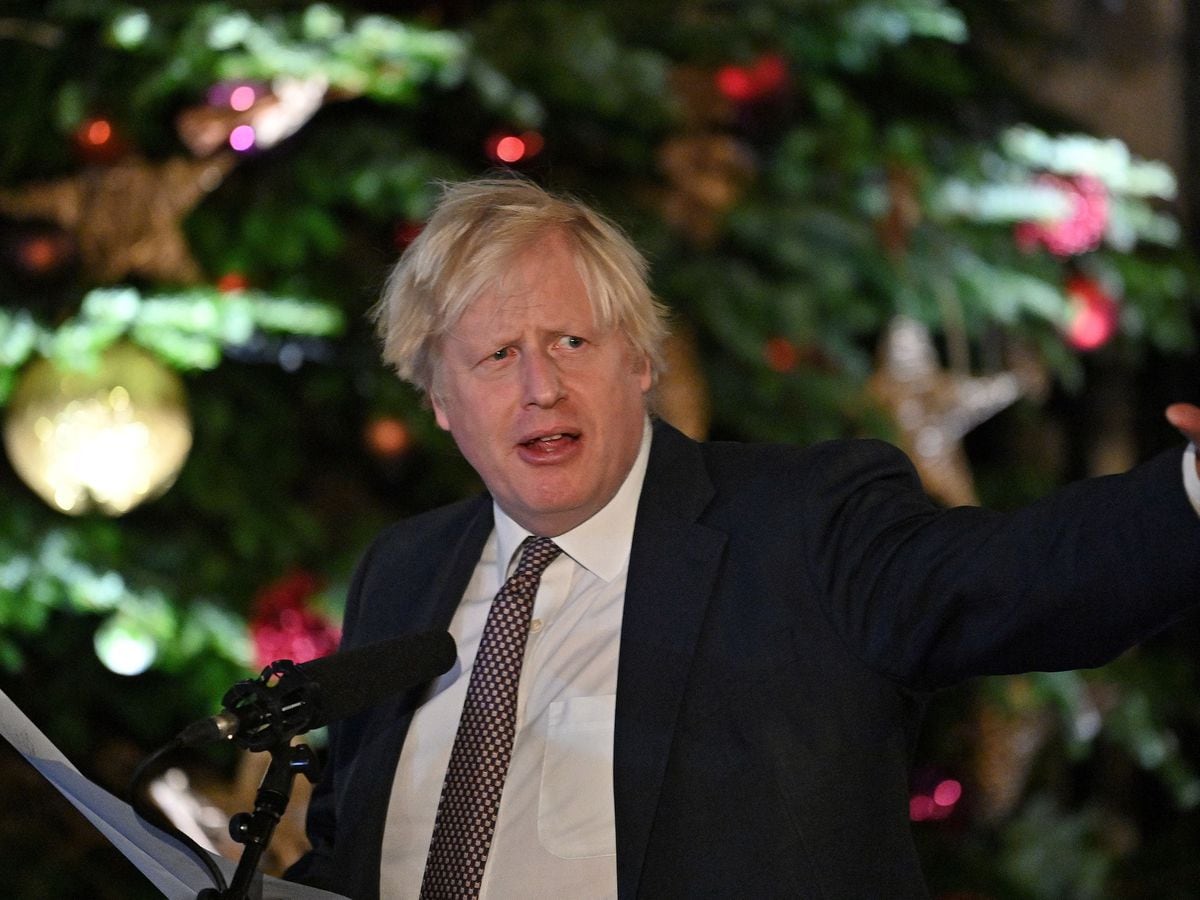 Boris Johnson by the Christmas tree outside 10 Downing Street