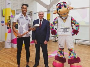 Team England netball player Layla Guscoth and Cllr Ian Ward, Leader of Birmingham City Council with the baton at Birmingham Airport