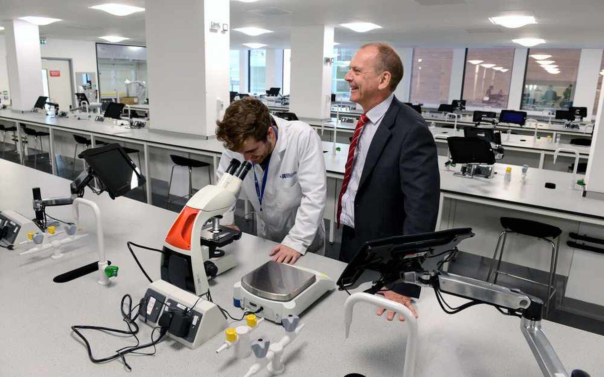 Chemistry technician Matthew Walden with Professor Geoff Layer, the vice chancellor, in one of the new labs