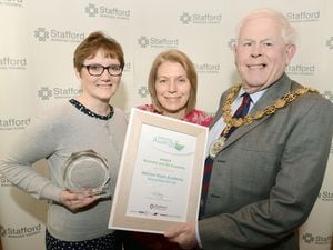 The Mayor of Stafford, Councillor Gareth Jones presents Stafford Borough Council's Community Award to Mary Walker, left and Tracy Owen from The Weston Road Academy