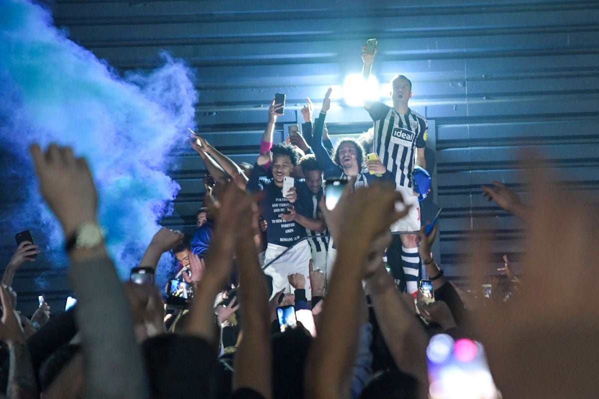 West Brom players and fans celebrate outside The Hawthorns. Photo: SnapperSK