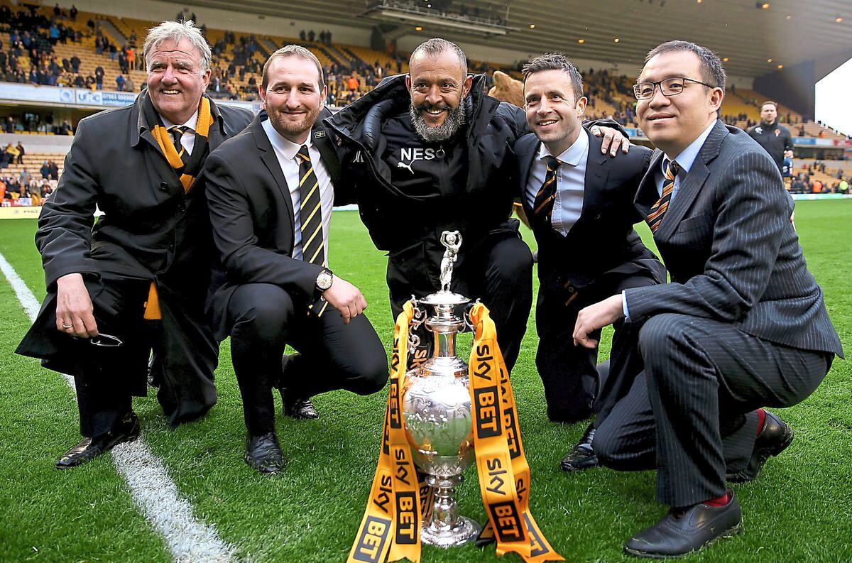 Quest for success: Wolves’ managing director Laurie Dalrymple (second right), executive chairman Jeff Shi (right), sporting director Kevin Thelwell (second left), director John Gough (left) and head coach Nuno Espirito Santo (centre) after the club clinched the Championship title last season