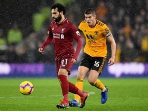 Mohamed Salah of Liverpool and Conor Coady of Wolverhampton Wanderers. (AMA)