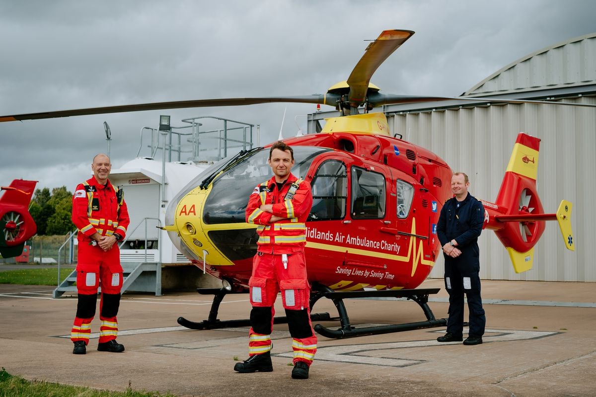 Midlands Air Ambulance critical care paramedics Mike Andrews and Pete Edwards with pilot Alastair Lees, at the charity's Cosford base.