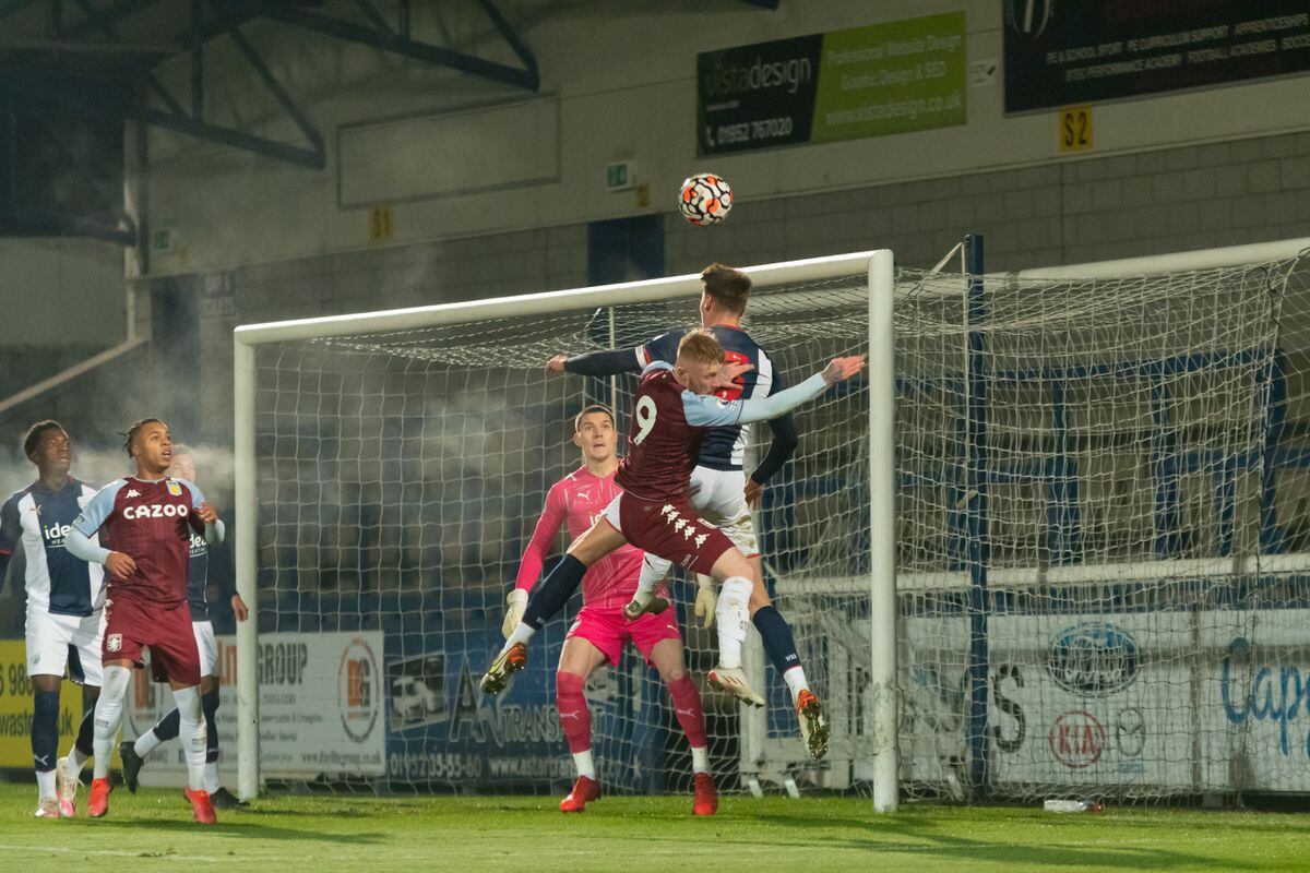 West Bromwich Albions Caleb Taylor Battling in the air to win the header with Aston Villas Brad Young