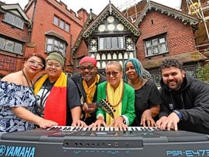 Cherry Morrison, Candice, Basil and Catherine Gabbidon and Ola Brown play a tune outside Wightwick Manor