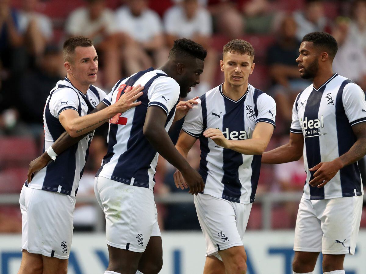Daryl Dike of West Bromwich Albion celebrates after scoring a goal to make it 0-1 with Jed Wallace of West Bromwich Albion, Conor Townsend  of West Bromwich Albion and Darnell Furlong of West Bromwich Albion at Sixfields on July 13, 2022 in Northampton, England. (Photo by Adam Fradgley/West Bromwich Albion FC via Getty Images).