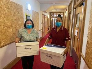 Annette Weston and Lorna Marr help clear the hospice ready for work to begin