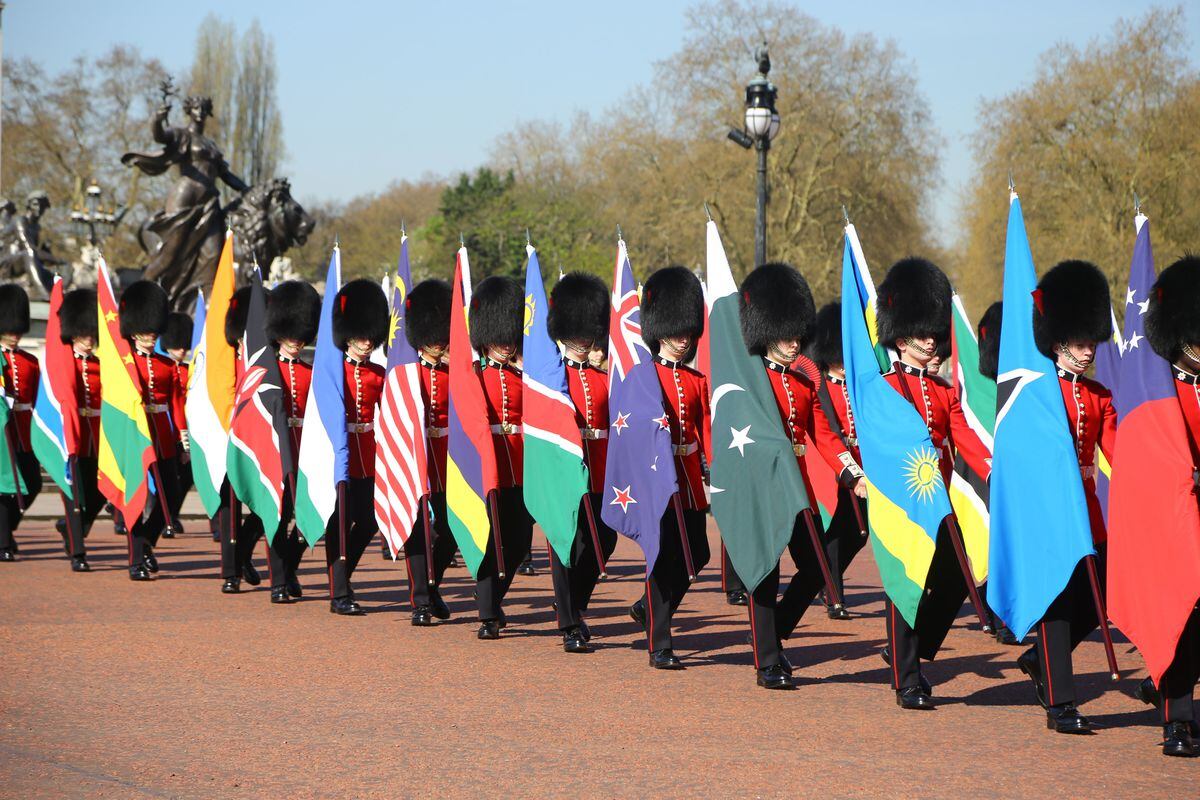 The Queen’s Guard carrying the flags of some of the Commonwealth countries
