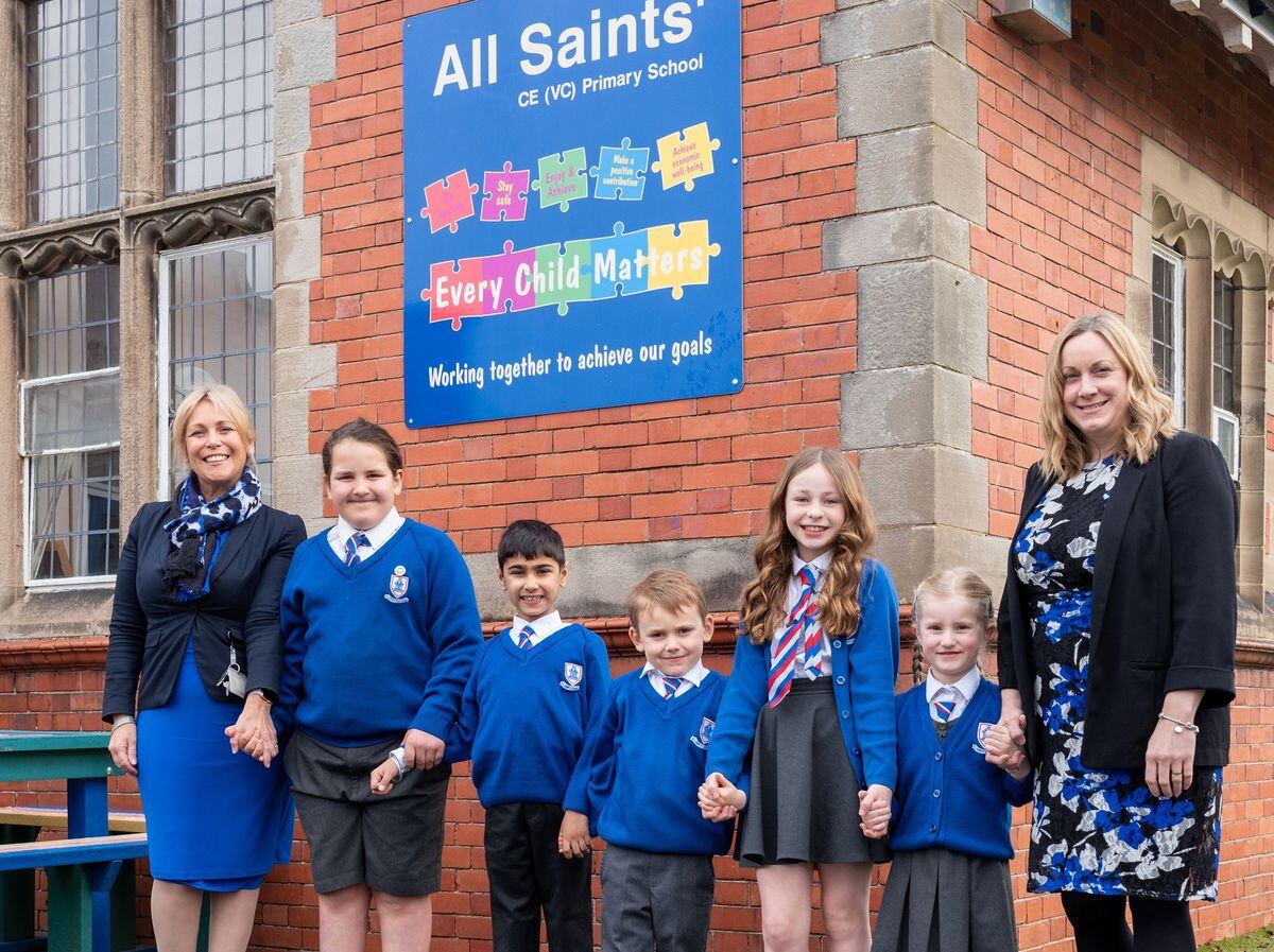 Pupils are joined by, left, Katy Kent, CEO of the St Bartholomew's CE Multi Academy Trust, and right, headteacher Louise de Graaff, to celebrate All Saints’ CE Primary School’s good Ofsted rating