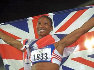 Great Britain's Denise Lewis celebrates winning the Gold medal in the Women's Heptathlon at the Olympic Games in Sydney today, Sunday 24th September 2000. PA Photo : John Giles.