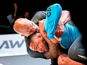 Former Wolves goalkeeper Carl Ikeme has an opponent at his mercy in a headlock during a jiu-jitsu competition