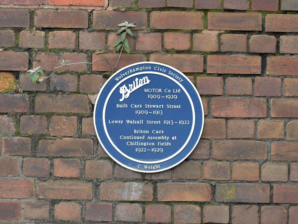 The blue plaque can be seen on the building.