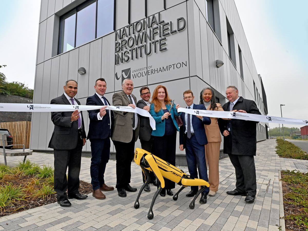 Official opening of the National Brownfield Institute, based at the University of Wolverhampton's Springfield Campus. Opening the Institute: West Midlands Mayor Andy Street, Jane Stevenson MP, Stuart Anderson MP, and council leader Ian Brookfield, with Spot the robot dog. Jane Stevenson MP cuts the ribbon.