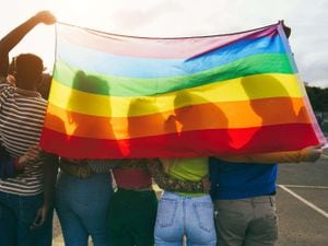Pupils with rainbow flag
