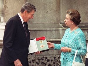 Former US President Ronald Reagan with the Queen, who bestowed one of the highest orders of chivalry