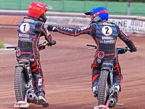 Put it there, partner! Sam Masters and Steve Worrall celebrate a win at Monmore last night  Picture: Steve Feeney