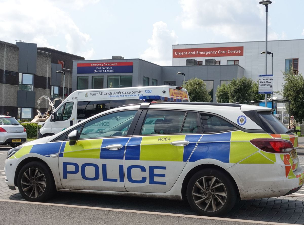 Police at the Emergency Department entrance of New Cross Hospital in Wolverhampton after a member of staff was stabbed