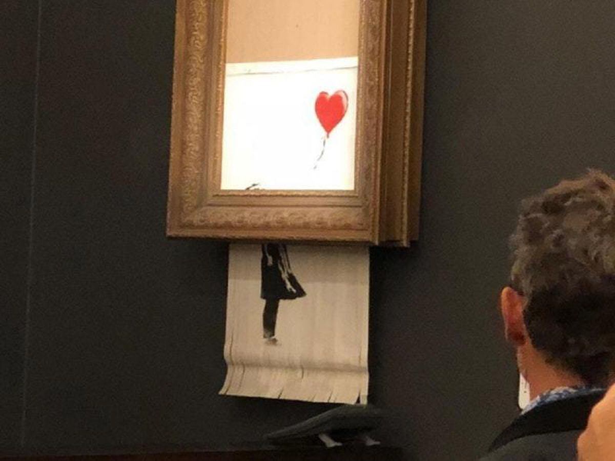 Banksy artwork shreds itself after being sold at auction | Express & Star