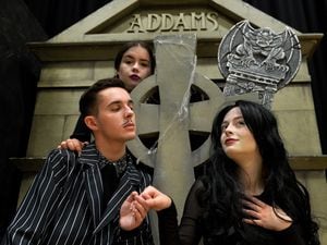Highfields school production of the Addams family. Pictured left, Owen Whittle as Gomez,Emily Longman as Wednesday and Sophie Bates as Morticia..