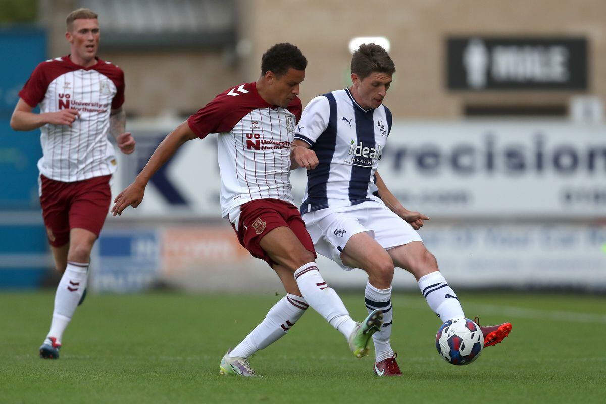 Shaun McWilliams of Northampton Town and Adam Reach of West Bromwich Albion at Sixfields on July 13, 2022 in Northampton, England. (Photo by Adam Fradgley/West Bromwich Albion FC via Getty Images).