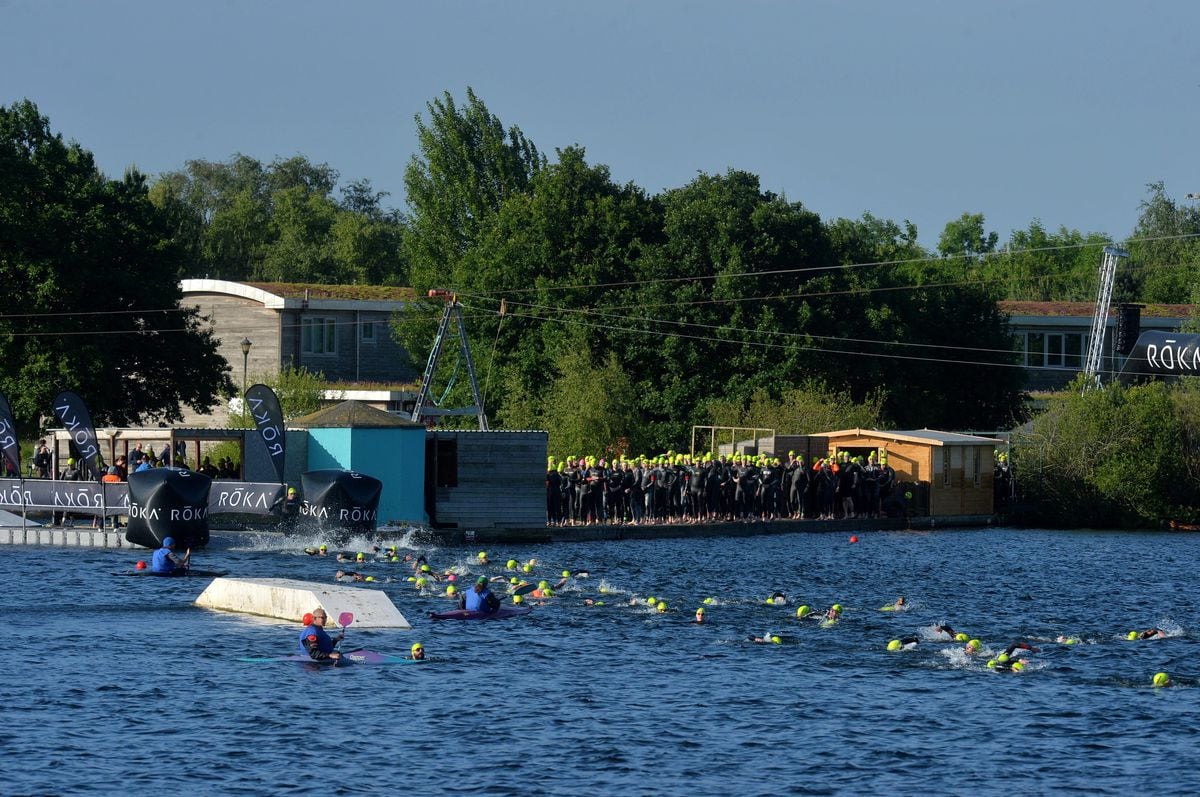 Competitors in the 2022 race head out into Chasewater on the swim leg