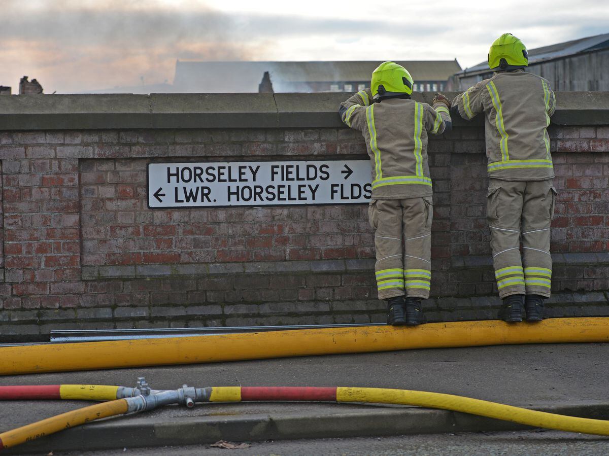 Firefighters on the Willenhall Road, Wolverhampton - closed due to the fire. 