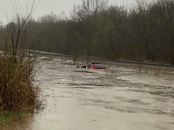 A car is seen submerged in floodwater in Granby, Missouri (Layton Hoyer via AP)
