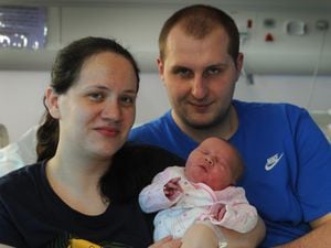 Mother Michelle White, and father Liam Blackwell, both of Wolverhampton, with their New Year baby Grace Blackwell