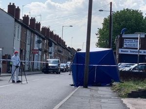 A forensic officer at the scene of the stab attack in Darlaston. Photo: John Kennett