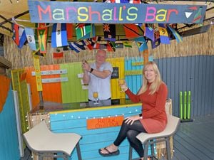 Mark and Lynn Marshall have created a Caribbean beach bar in their back garden during lockdown.