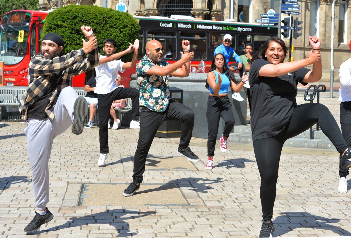 Parvinder joins in with the dancing in Queen Square.