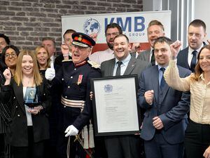 John Crabtree, the Lord lieutenant of the West Midlands, celebrates with the team from KMB Shipping