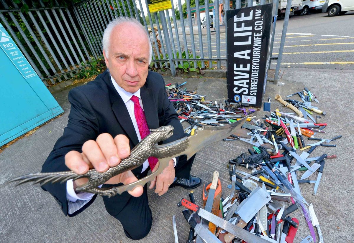 Police and Crime Commissioner David Jamieson examines weapons collected at a knife bin in the Bilston area