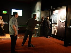 A darts open qualifying event taking place at Rileys Sports Bar, Wolverhampton in 2015.