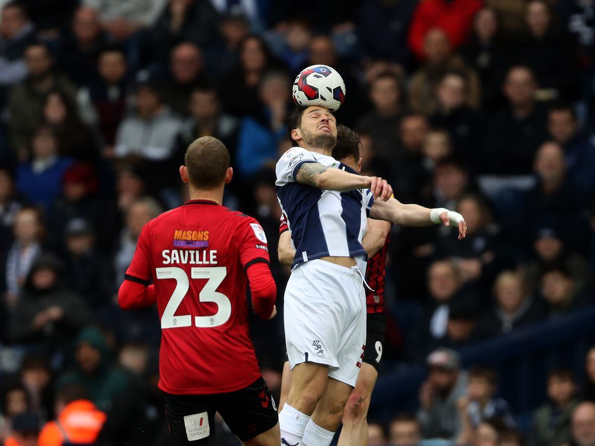 Stand in captain Okay Yokuslu goes up for a header (Photo by Adam Fradgley/West Bromwich Albion FC via Getty Images).