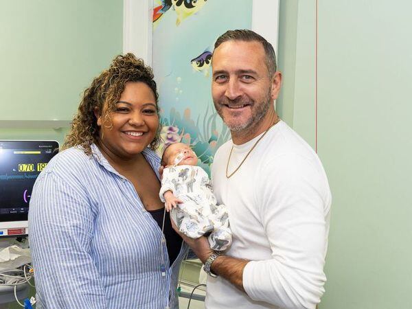 Will Mellor pictured snuggling with a newborn on his visit to the unit. Photo: Walsall Healthcare NHS Trust