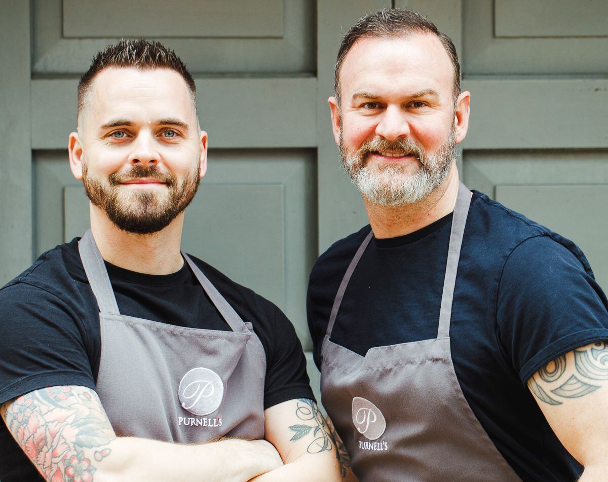 The chef (right) works with a strong team