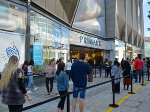 Hundreds of people queue at Primark in Birmingham which has reopened today