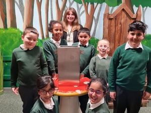 Rebecca Templeton, Proposals Manager for Interclass, with the seven pupils who provided their drawings and writings for the time capsule.​