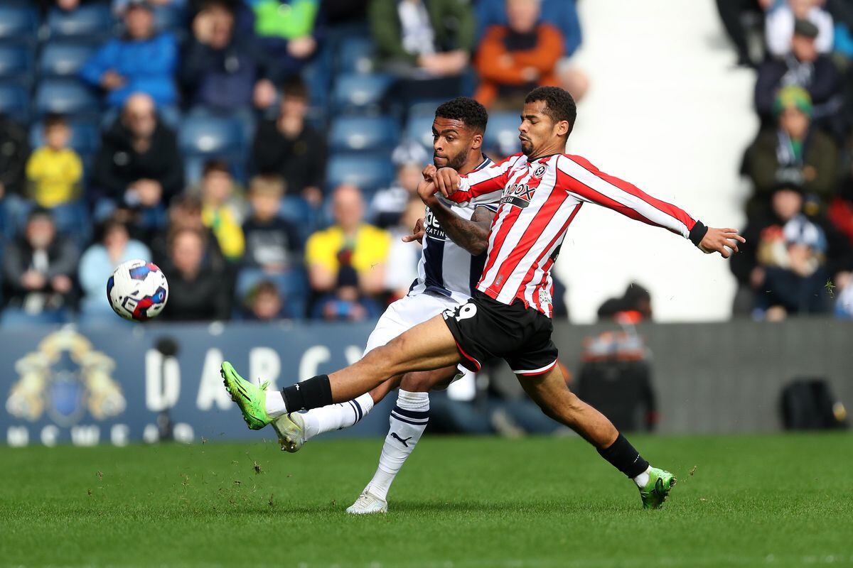 Darnell Furlong of West Bromwich Albion and Iliman Ndiaye of Sheffield United during the Sky Bet Championship between West Bromwich Albion and Sheffield United at The Hawthorns on October 29, 2022 in West Bromwich, United Kingdom. (Photo by Adam Fradgley/West Bromwich Albion FC via Getty Images).