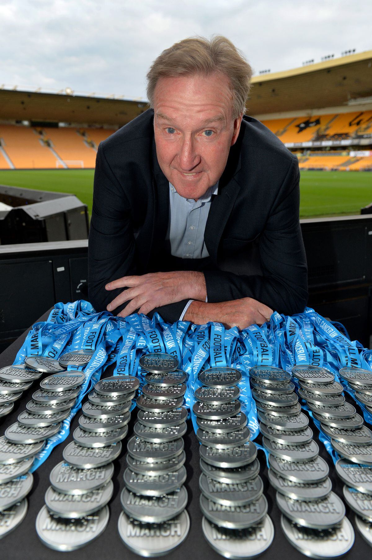 Ex-Wolves player Steve Daley presents the medals at the Prostate Cancer UK event 