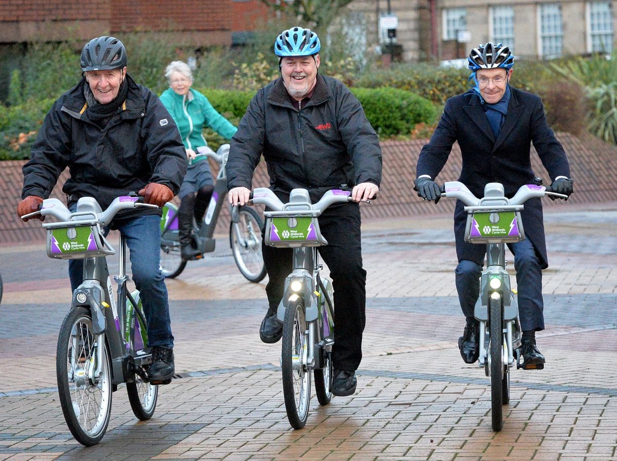  Hugh Porter MBE joins Ian Brookfield, centre, and Andy Street to try out the e-bikes in St Peter’s Square