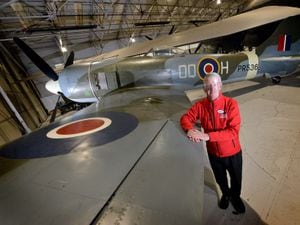 Visitor experience assistant Martin Hill, from Claverley, with the new arrival now on display at the RAF Cosford Museum